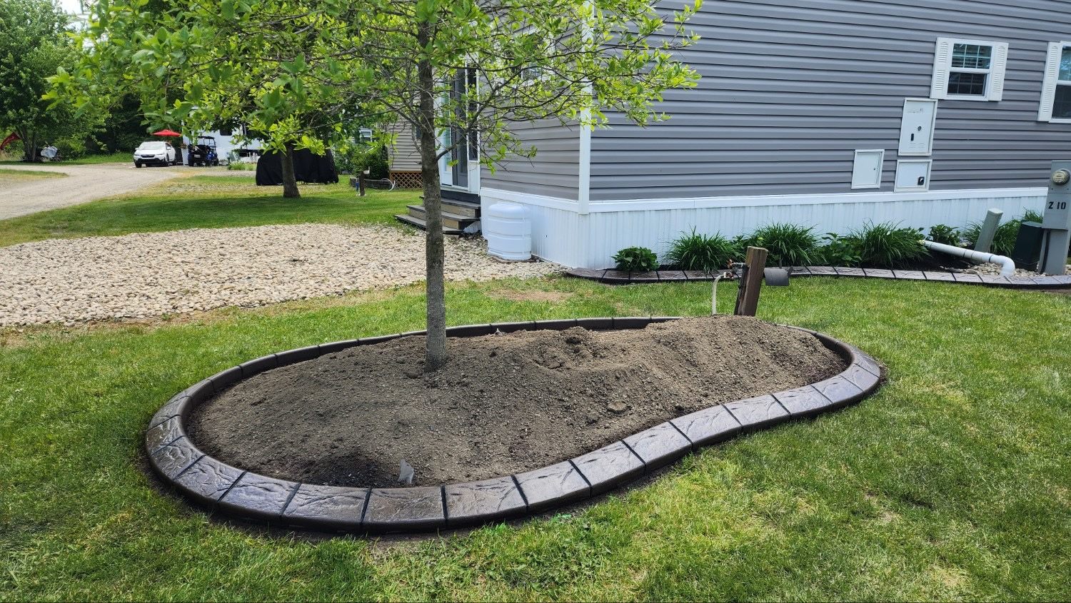 Decorative curbing around a tree bed